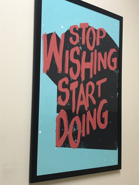 poster with inspirational quote "Stop Wishing Start Doing"